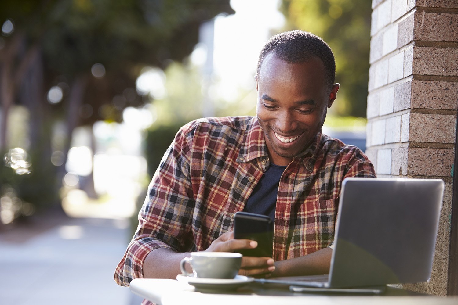 photo_Man_at_Table_with_Smartphone.jpg